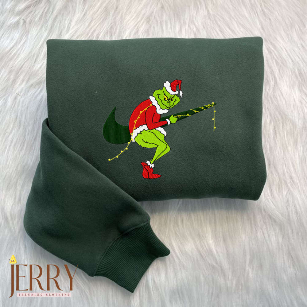 Get Festive with Grinch Steals Garland Nike Embroidered Sweatshirts: Perfect Grinch Christmas Sweatshirt!